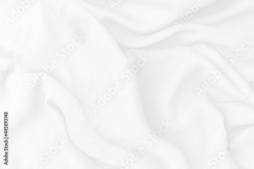 Cotton textile is wave beautiful for wallpaper. Top view white fabric luxurious softness smooth on white background with copy space. Design textured, abstract, background.