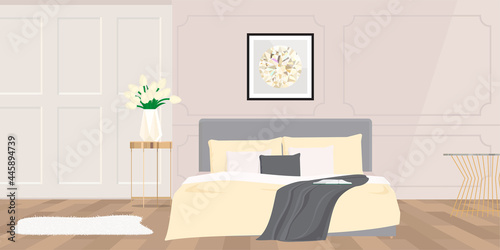 Bedroom with a bed in pale yellow tones