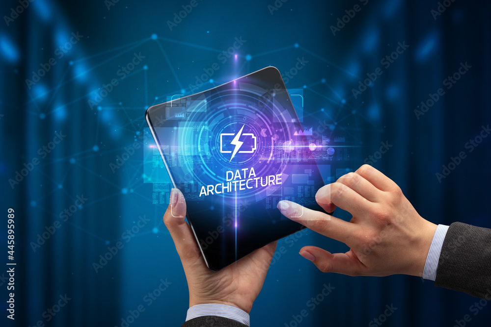 Fototapeta premium Businessman holding a foldable smartphone, technology concept