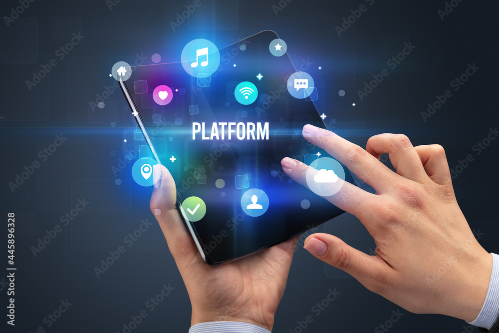 Businessman holding a foldable smartphone Businessman holding a foldable smartphone