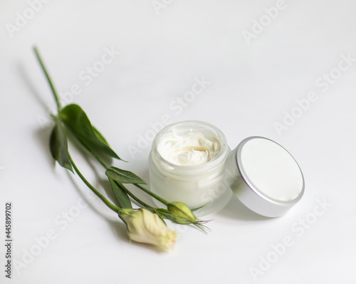 Cream in a jar on a white background