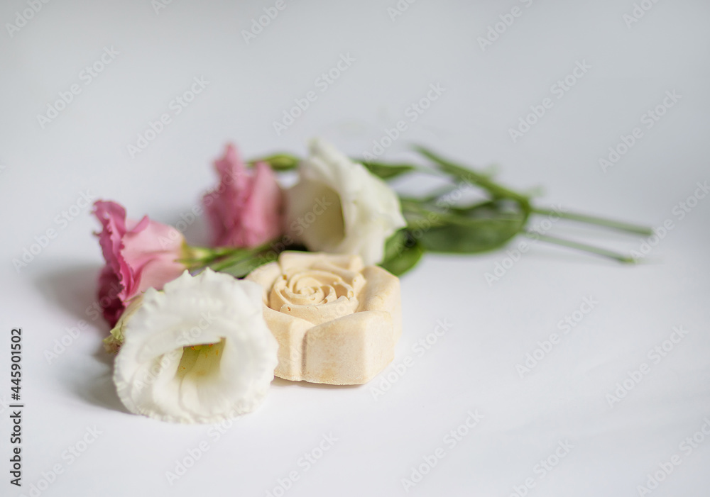 Handmade bath soap with flowers on a white background