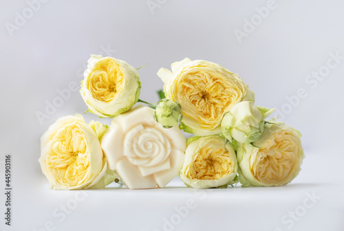 Handmade bath soap with flowers on a white background