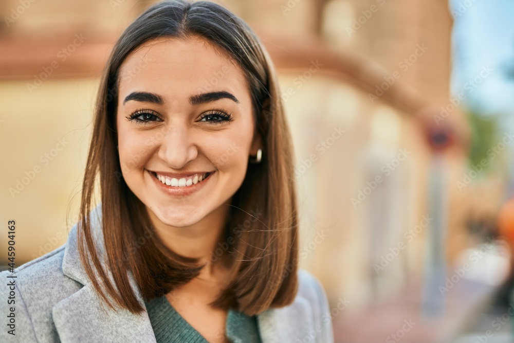 Young hispanic girl smiling happy standing at the city. Young hispanic girl smiling happy standing at the city.
