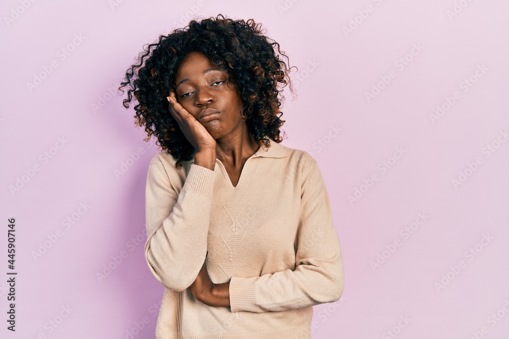 Young african american woman wearing casual clothes thinking looking tired and bored with depression problems with crossed arms.
