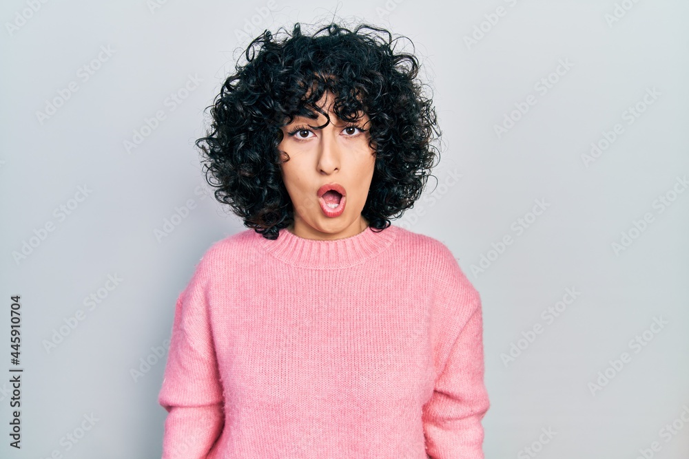 Young middle east woman wearing casual clothes in shock face, looking skeptical and sarcastic, surprised with open mouth Young middle east woman wearing casual clothes in shock face, looking skeptical and sarcastic, surprised with open mouth
