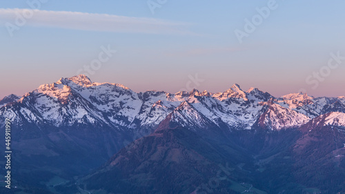 Snowy mountain range during sunrise