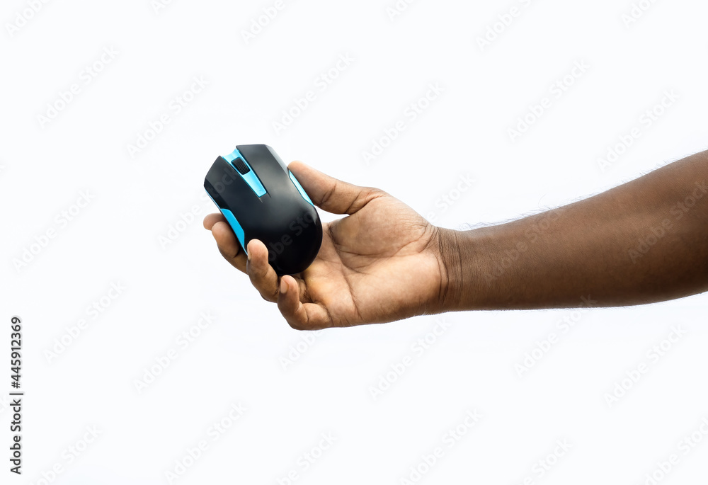 Fototapeta premium Wireless computer mouse in the hand on the isolated white background