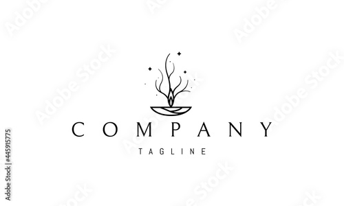 Vector logo on which an abstract image of a candle flame, smoke from which resembles a tree.