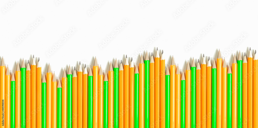 Orange and green pencils lie in a row on a light background. Stability without significant fluctuations, the concept of business success. Orange and green pencils lie in a row on a light background. Stability without significant fluctuations, the concept of business success.