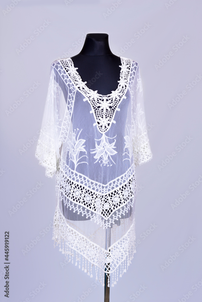 Modern woman dress on the figurine on a white Modern woman dress on the figurine on a white