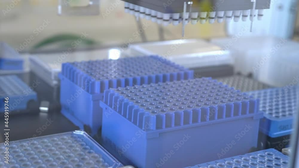 Automation in the clinical laboratory. Pipetting robot laboratory. Medicine robotics. automated pharmaceutical laboratory. Research and science background Automation in the clinical laboratory. Pipetting robot laboratory. Medicine robotics. automated pharmaceutical laboratory. Research and science background
