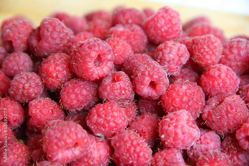 fresh raspberries on a white background close-up fresh raspberries on a white background close-up