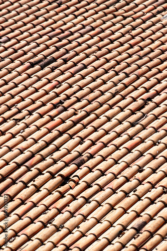 old weathered red roof tiles.