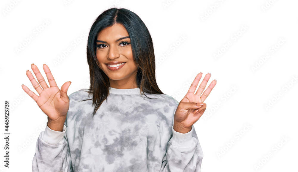 Young latin transsexual transgender woman wearing casual clothes showing and pointing up with fingers number eight while smiling confident and happy. Young latin transsexual transgender woman wearing casual clothes showing and pointing up with fingers number eight while smiling confident and happy.