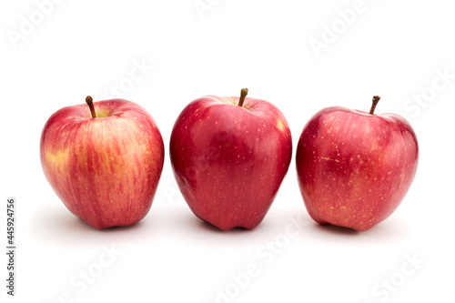 Few ripe red-yellow seasonal apples isolated on white background