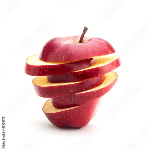 Stack of sliced red apple isolated on white background