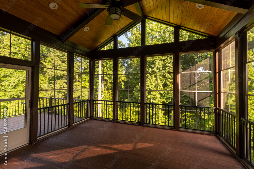 Modern new screened porch with plastic windows and composite floor with