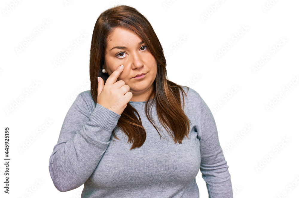 Beautiful brunette plus size woman wearing casual clothes pointing to the eye watching you gesture, suspicious expression Beautiful brunette plus size woman wearing casual clothes pointing to the eye watching you gesture, suspicious expression