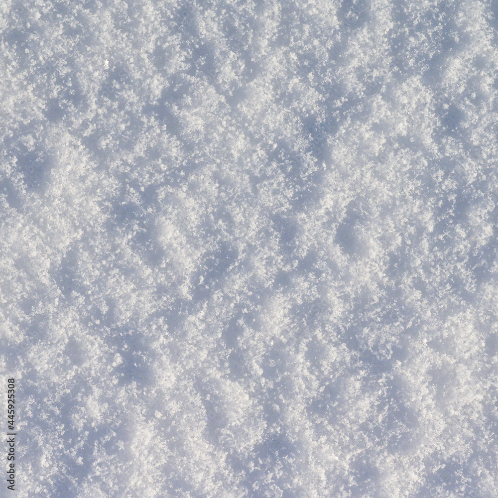 Obraz premium Winter snow background, ice crystals sparkling on snow, christmas texture, sparkling snowflakes in snowdrift.