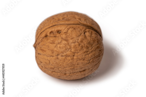 Walnut round brown nut. On a white isolated background. Delicious dessert.
