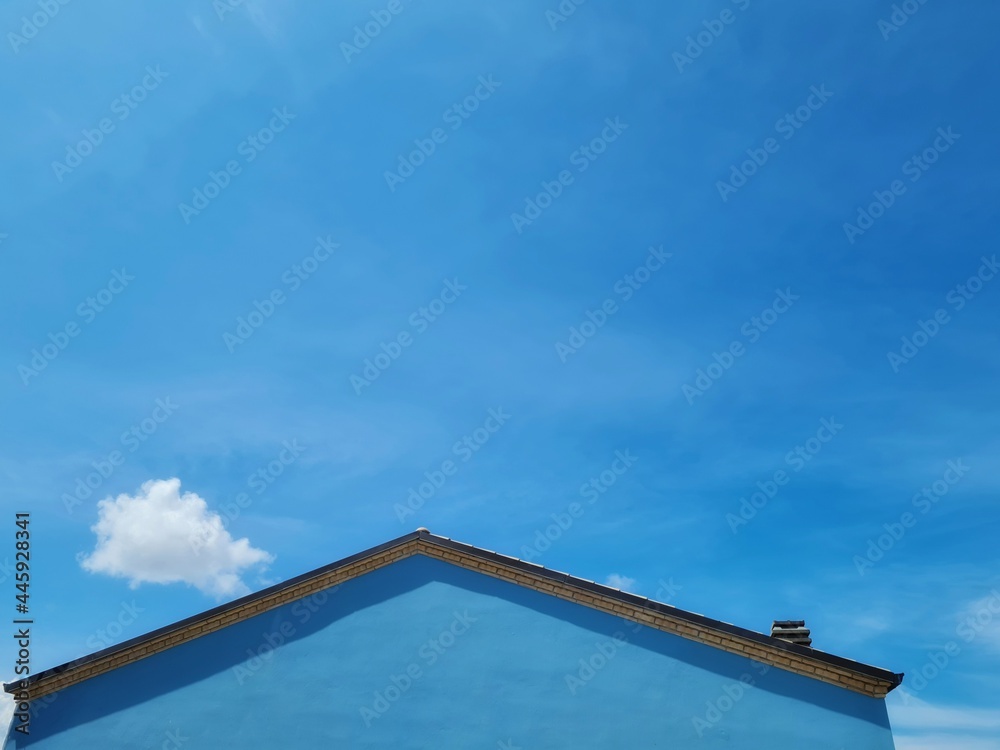 blue house blends in with the blue of the sky