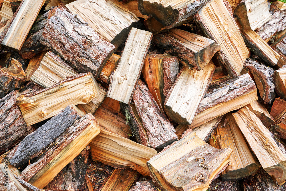 Wood chop stove. Woodpile texture background. Trees store. Hardwood pile stack. Wooden biomass wall. Split forest. Agriculture work Wood chop stove. Woodpile texture background. Trees store. Hardwood pile stack. Wooden biomass wall. Split forest. Agriculture work