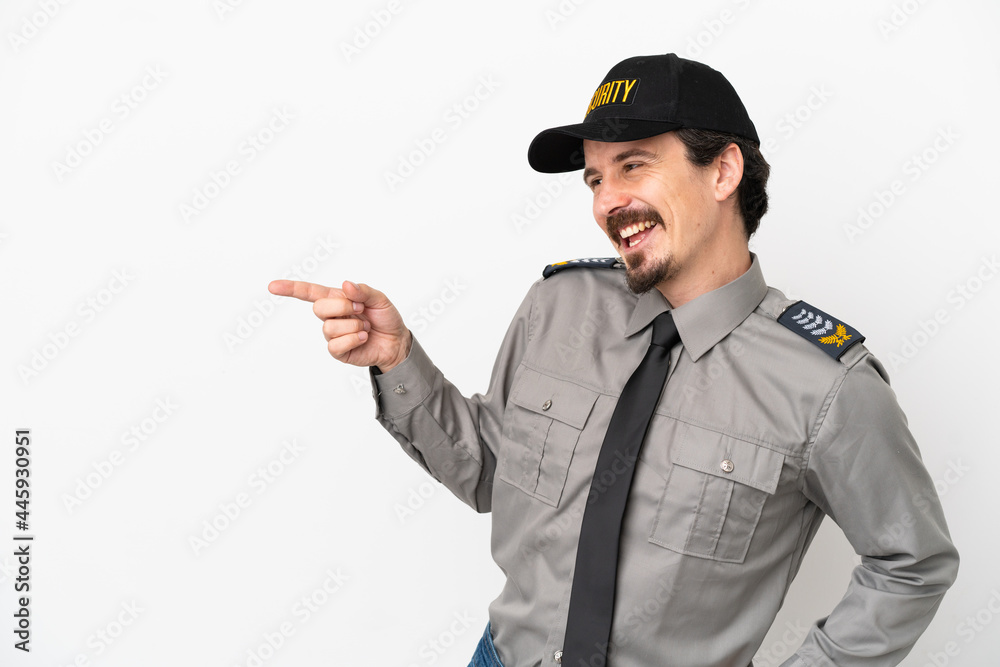Young caucasian security man isolated on white background pointing finger to the side and presenting a product Young caucasian security man isolated on white background pointing finger to the side and presenting a product