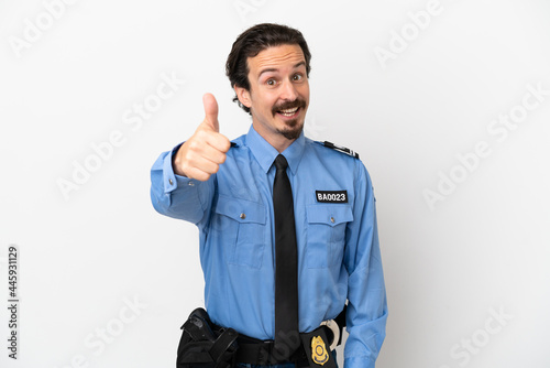 Young police man over isolated background white with thumbs up because something good has happened