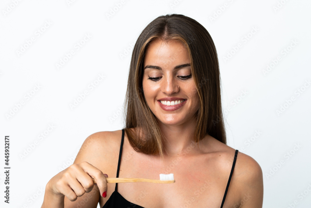 Young Uruguayan woman isolated on white background with a toothbrush Young Uruguayan woman isolated on white background with a toothbrush