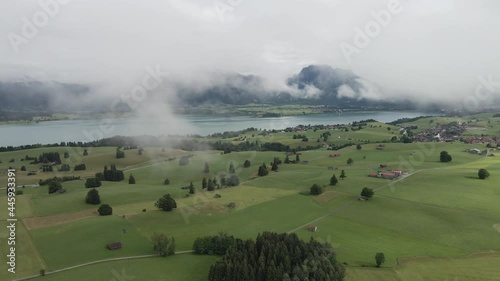 A flight in the Bavarian clouds with green forests