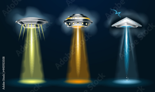 Alien spaceships with  light beam, smoke and glows. 3d vector ufo set