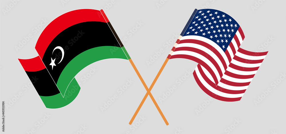 Crossed and waving flags of Libya and the USA Crossed and waving flags of Libya and the USA
