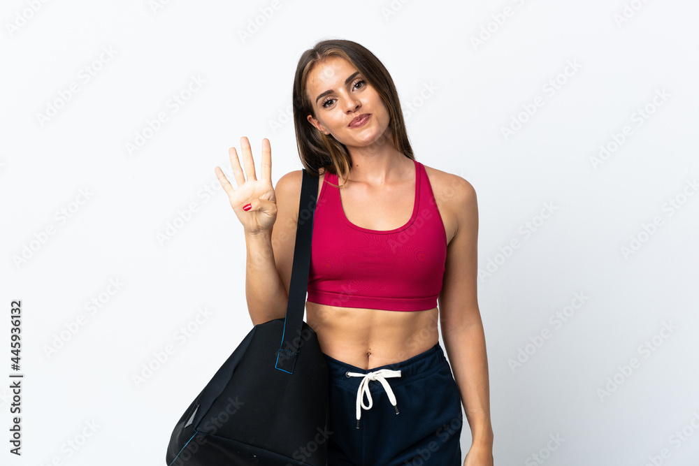 Young sport Uruguayan woman with sport bag isolated on white background happy and counting four with fingers