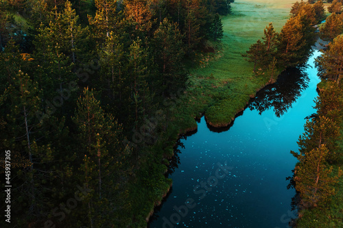 Aerial view of mountain creek winding through beautiful grassy landscape on Zlatibor, Serbia © Bits and Splits