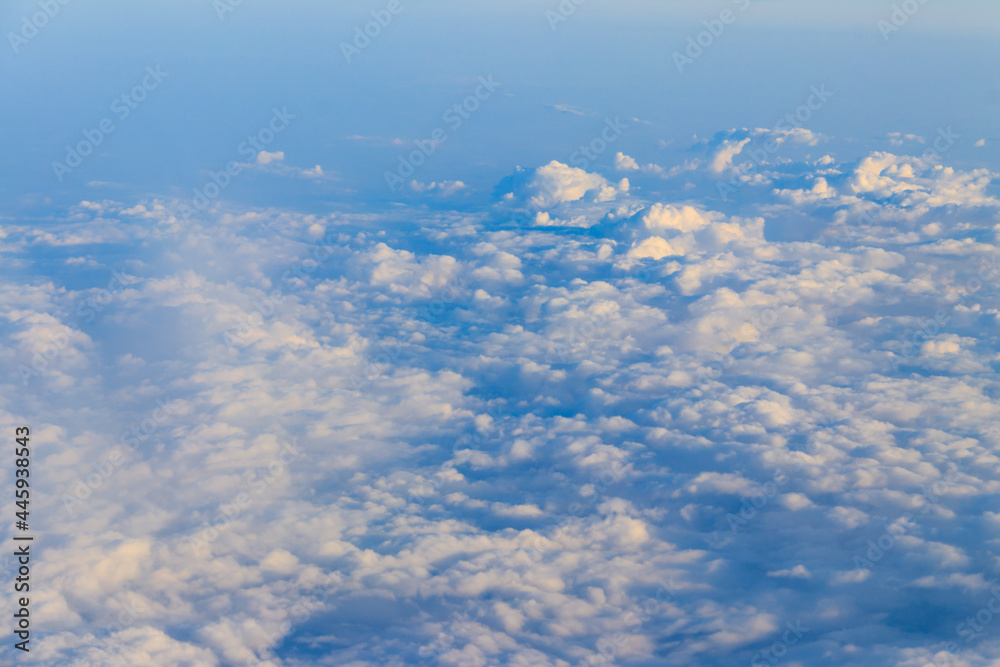 Beautiful white clouds in blue sky. View from airplane Beautiful white clouds in blue sky. View from airplane
