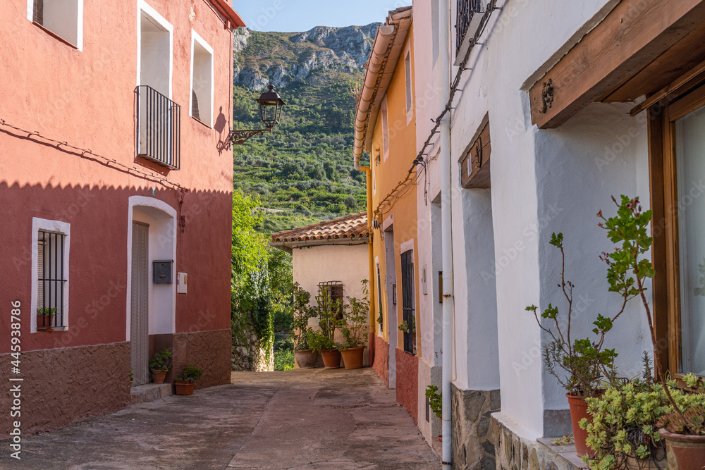 Nice street of a Spanish Mediterranean town adorned with plants