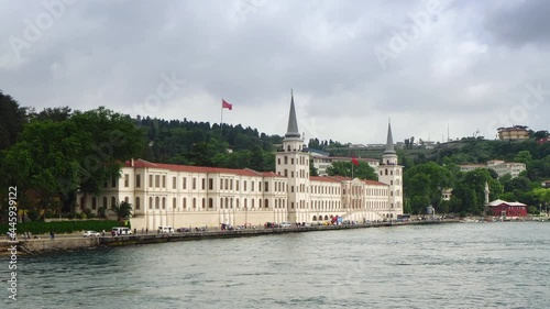 Military High School building with tower and flags of Turkey on seashore of Bosphorus strait, Istanbul, Turkey. photo