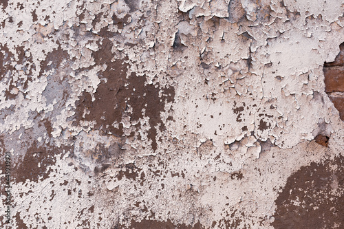 texture of old cracked wall with peeling plaster