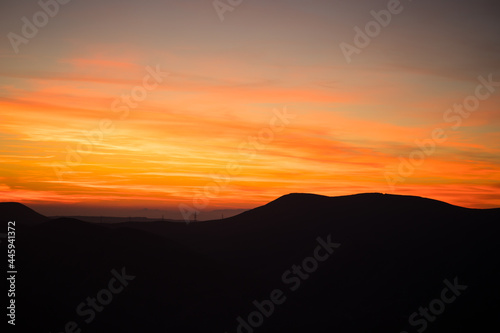 Colorful sunset over the mountain hills. Beautiful landscape in Azerbaijan nature.