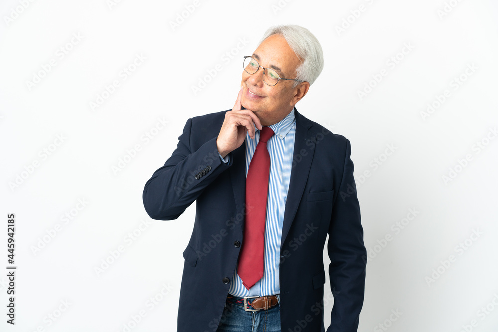 Middle age Brazilian business man isolated on white background thinking an idea while looking up Middle age Brazilian business man isolated on white background thinking an idea while looking up