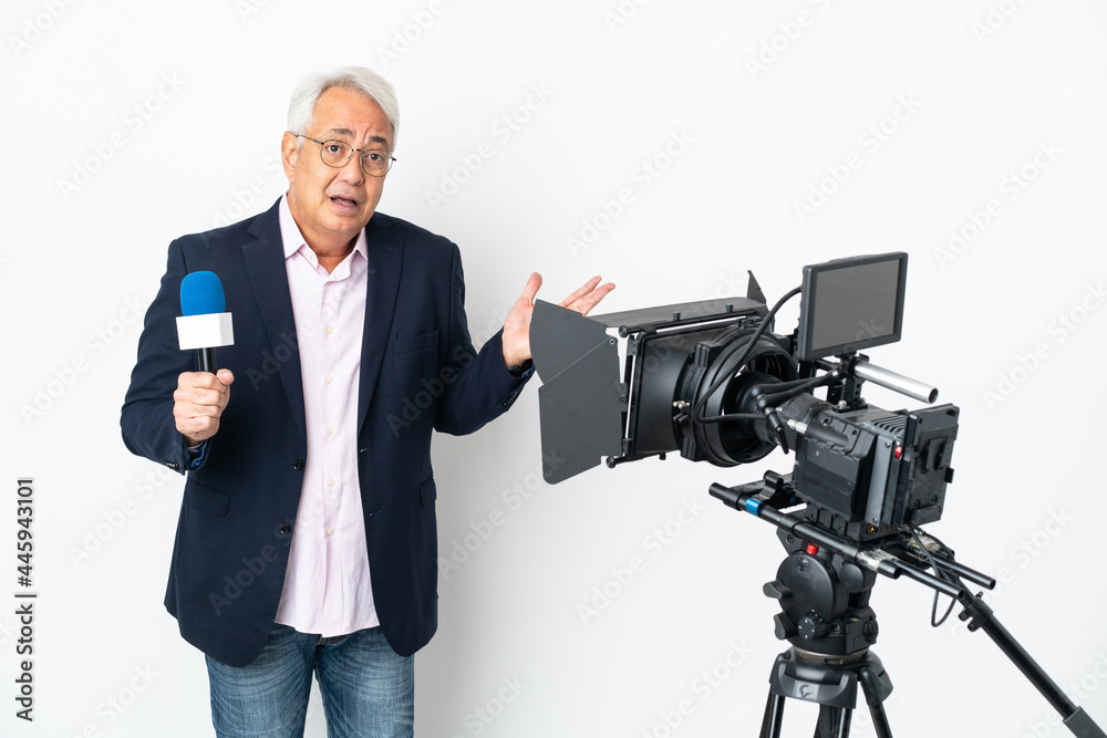 Reporter Middle age Brazilian man holding a microphone and reporting news isolated on white background having doubts while raising hands