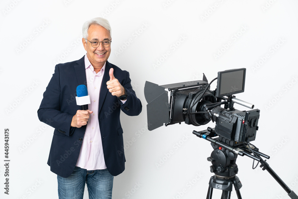 Reporter Middle age Brazilian man holding a microphone and reporting news isolated on white background with thumbs up because something good has happened