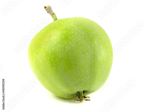 Fotografie Green apple with peduncle isolated on white background.