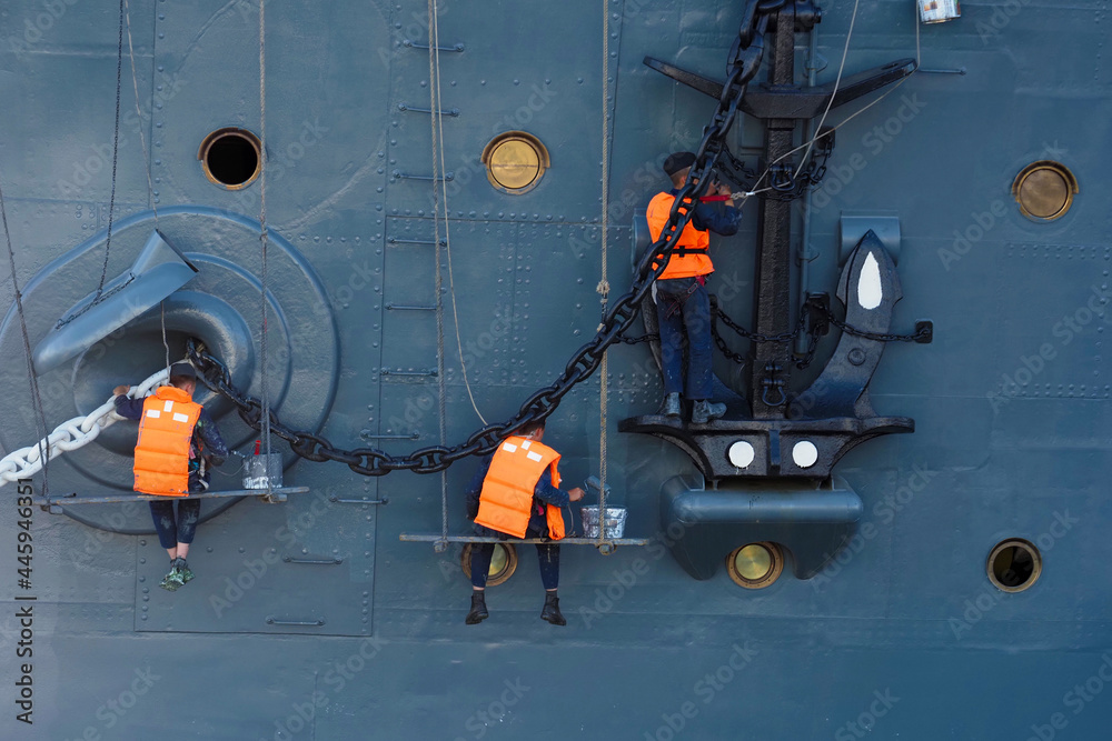 Sailors paint the cruiser Aurora or Avrora for the holiday, Saint Petersburg, Russia