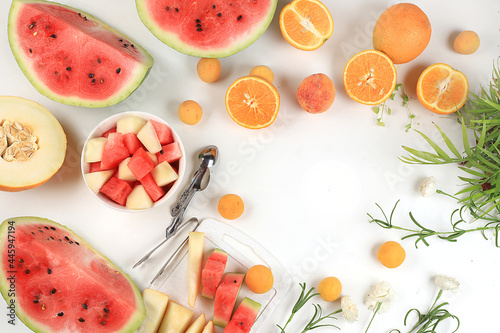 Fototapeta Naklejka Na Ścianę i Meble -  Fresh tropical fruits and berries on a bright sunny table, natural and healthy food concept, source of vitamins and antioxidants, ingredients for healthy breakfast, detox diet