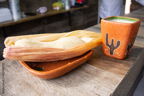 Traditional Mexican tamal and atole drink photo