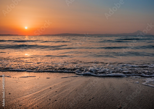 sunrise on the beach with waves