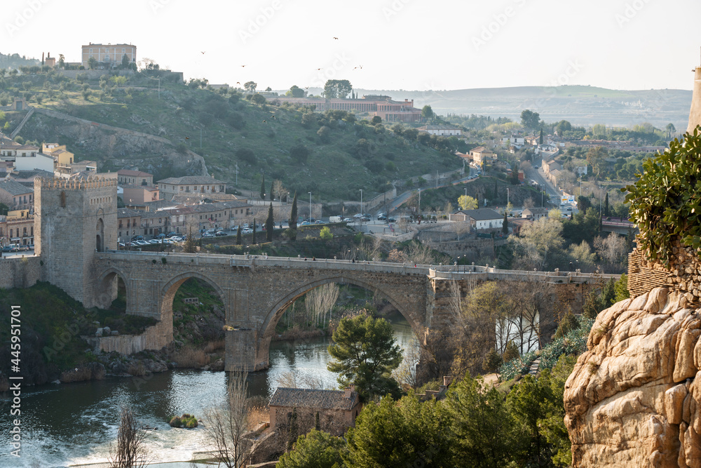 Puente de San Martín at the entrance to Toledo, the riverbed passes slowly through the eyes of the old bridge