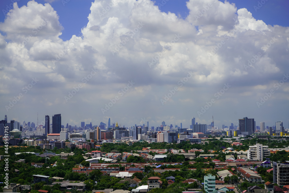 Fototapeta premium view of the city with cloudy sky on blue sky background